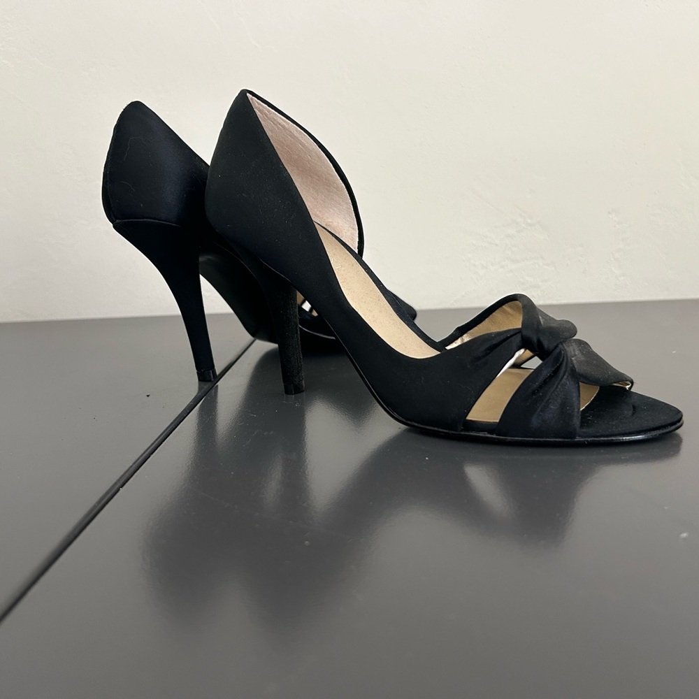 Women’s Nine West size 6 1/2 black satin pump. 3 1/2” heel.